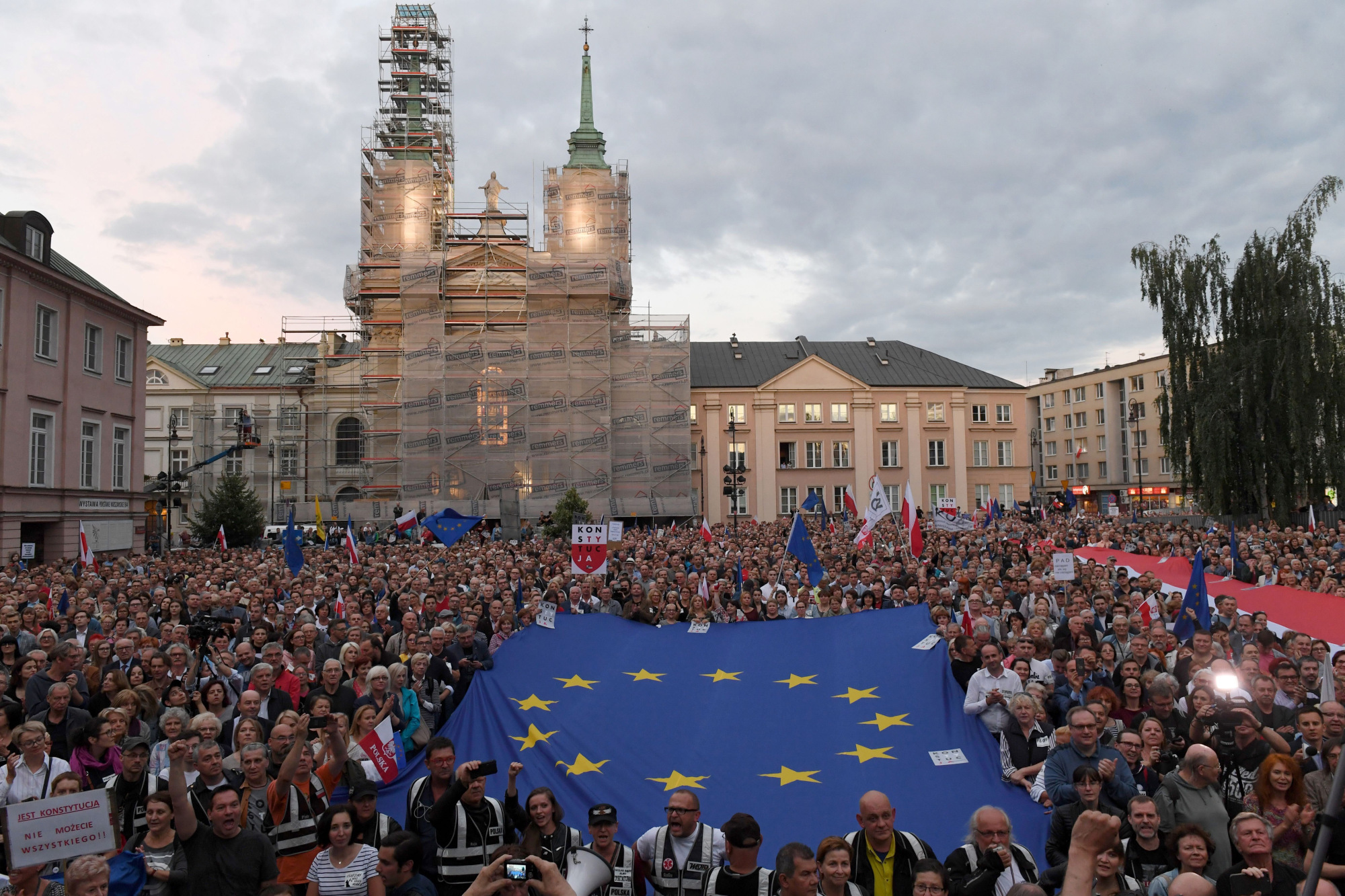 EU Takes Poland To Court Over Rule Of Law In Historic First - Bloomberg