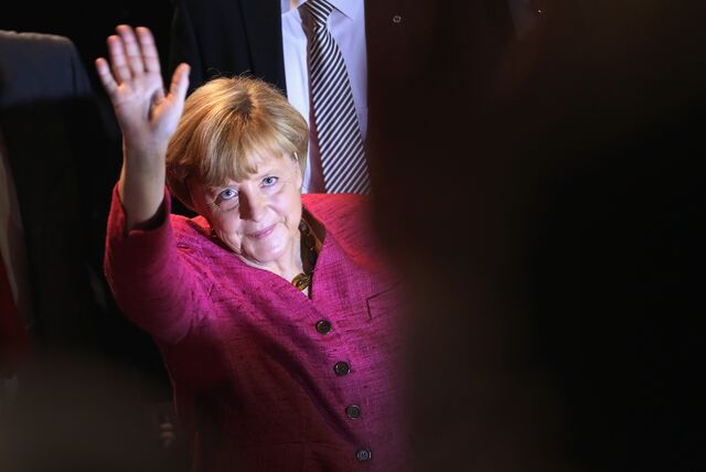 German Chancellor and Chairwoman of the German Christian Democrats (CDU) Angela Merkel waves as she departs after speaking at a CDU election rally the day before federal elections on September 21, 2013 in Berlin, Germany.
