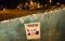 A poster that reads 'Wanted Emmanuel Besnier CEO Lacatalis' is left after milk producers dismantled installations after a demonstration at the Lactalis group headquarters, on Aug. 27, in Change.