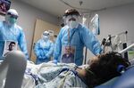 Medical staff members check on a patient at the Covid-19 Intensive Care Unit&nbsp;of a hospital in Houston, Texas, on Nov. 8.