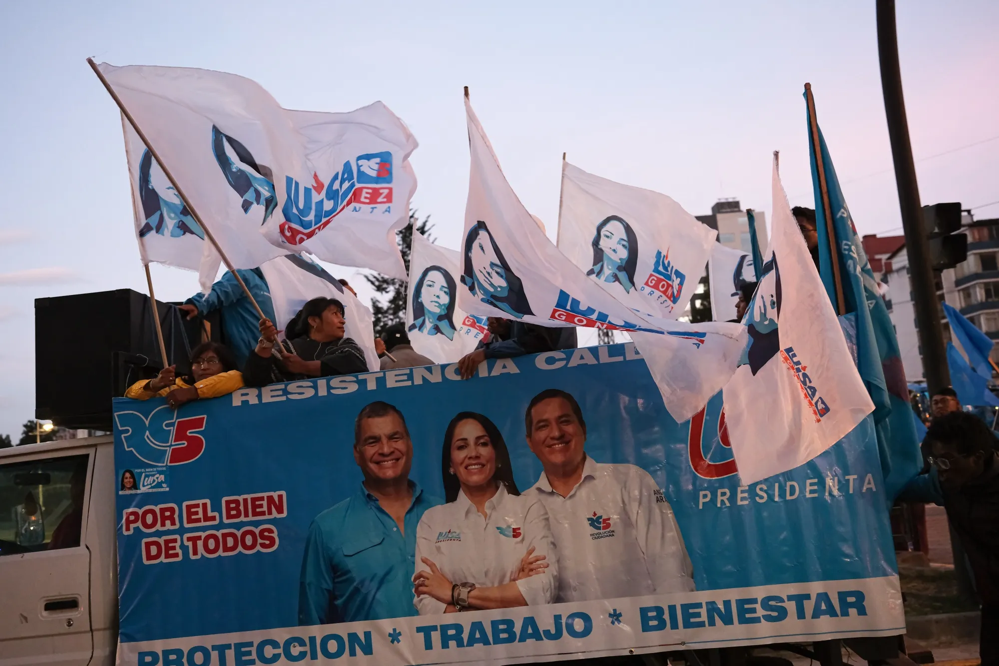 Supporters of the Revolucion Ciudadana party rally around the public channel Ecuador TV in 2023.