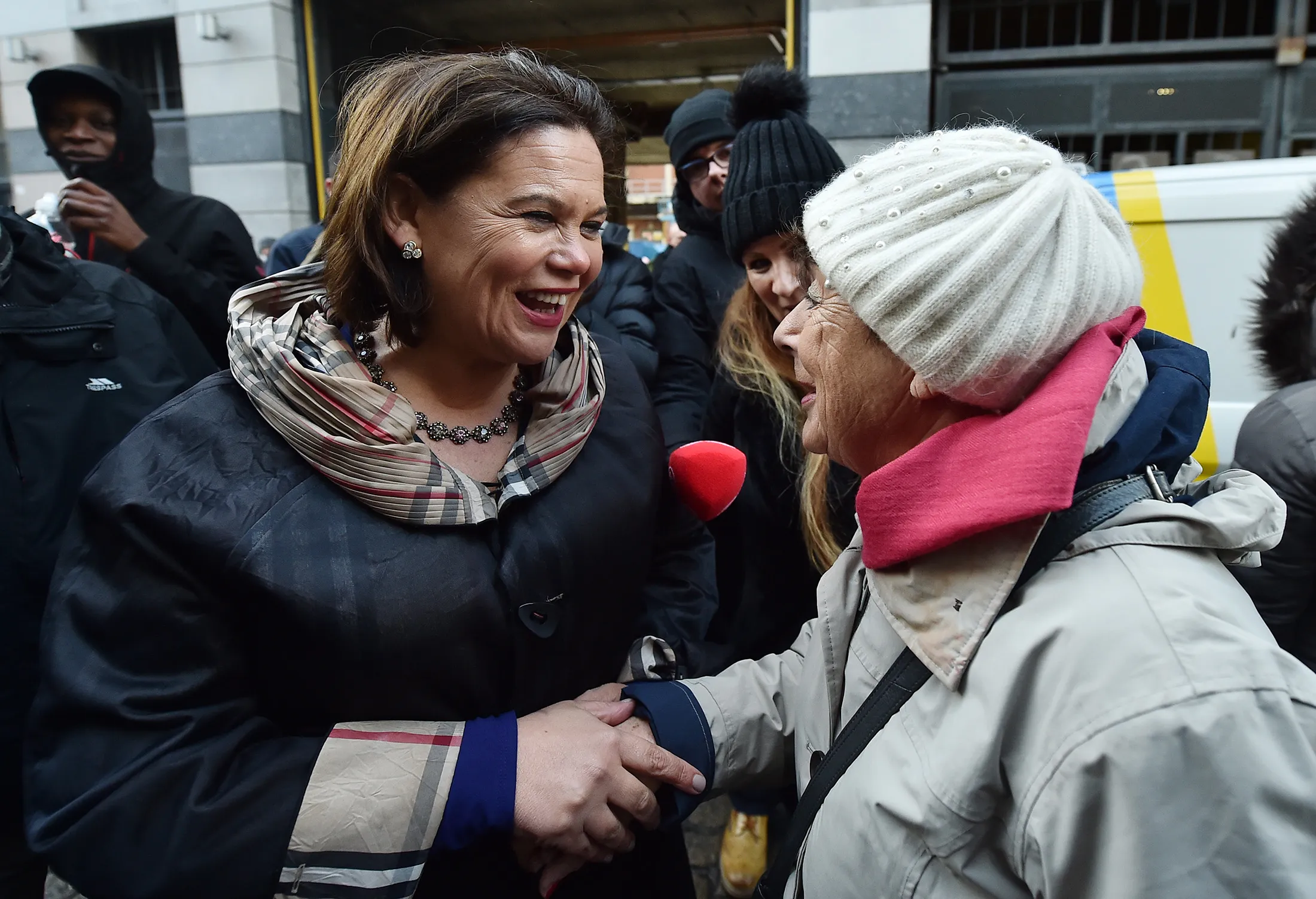 Mary Lou McDonald, left, greets supporters in Dublin City Centre on Feb. 10.