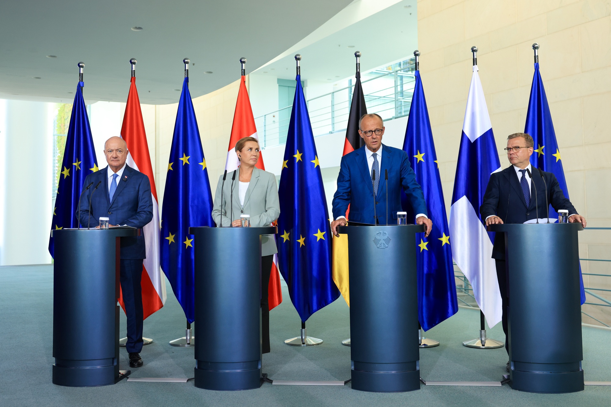 Christian Stocker, Austria’s chancellor, Mette Frederiksen, Denmark’s prime minister, Friedrich Merz, Germany’s chancellor, and Petteri Orpo, Finland’s prime minister, left to right, during press statements following talks for the so-called multiannual financial framework, also known as MFF, at the Chancellery in Berlin, Germany, on Thursday, Aug. 27, 2026. The MFF sets spending priorities across areas such as cohesion, agriculture, research, migration and defense issues. Photographer: Krisztian Bocsi/Bloomberg