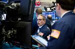 Traders work on the floor of the New York Stock Exchange (NYSE) in New York, U.S.