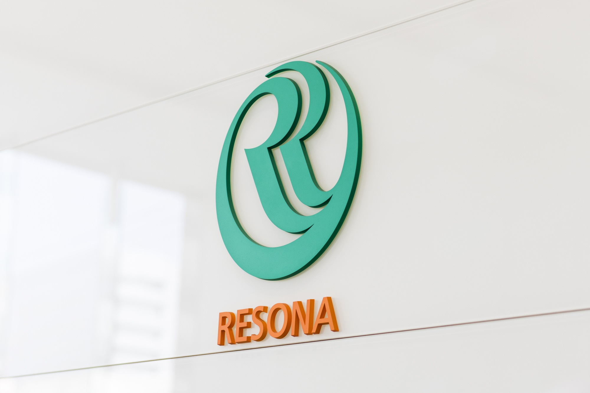 The Resona Holdings Inc. logo is displayed at the company's offices in Tokyo.