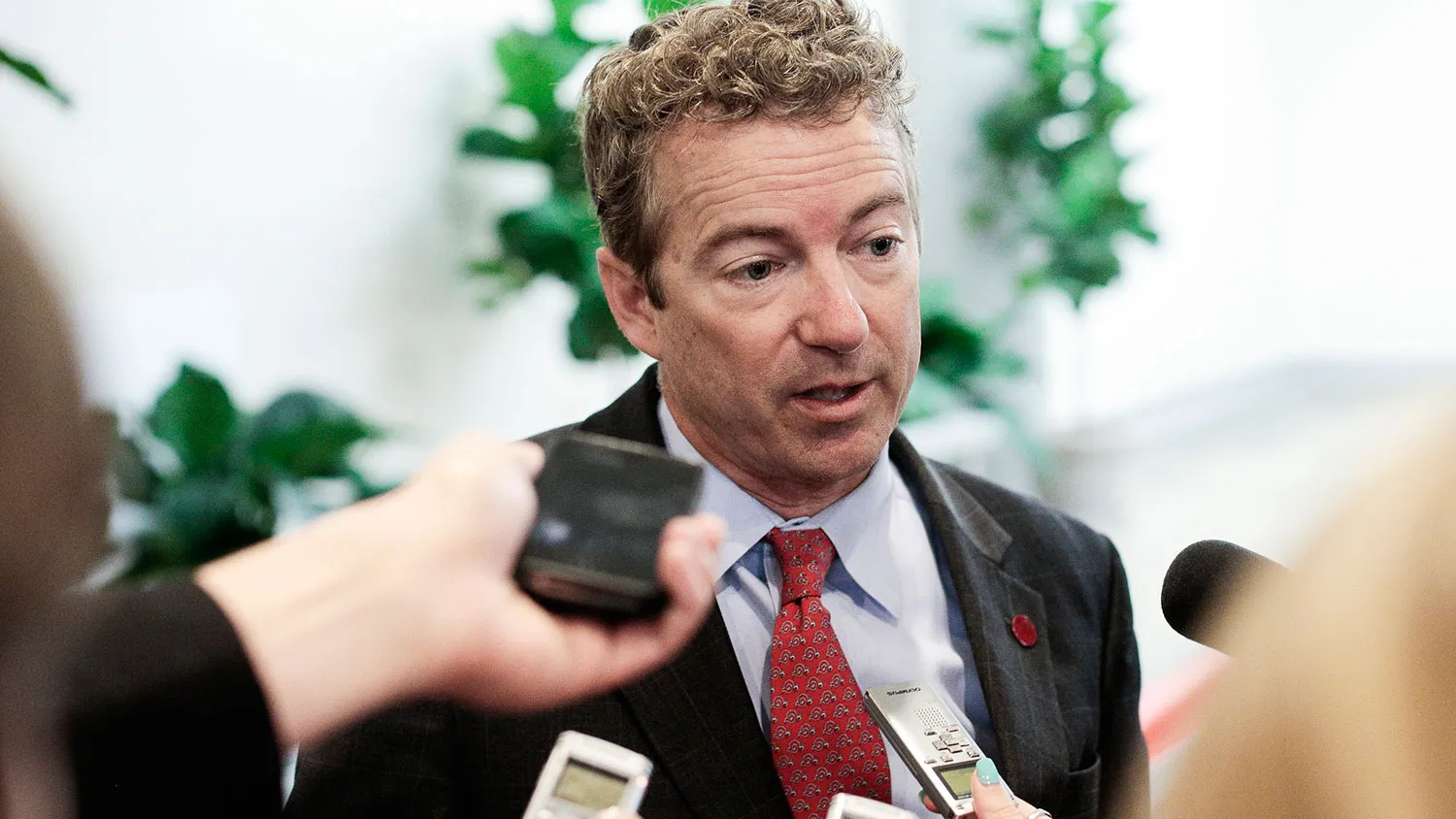 U.S. Sen. Rand Paul (R-KY) talks with reporters as Senate Republicans and Democrats head to their weekly policy luncheon on March 19, 2013 in Washington, DC.
