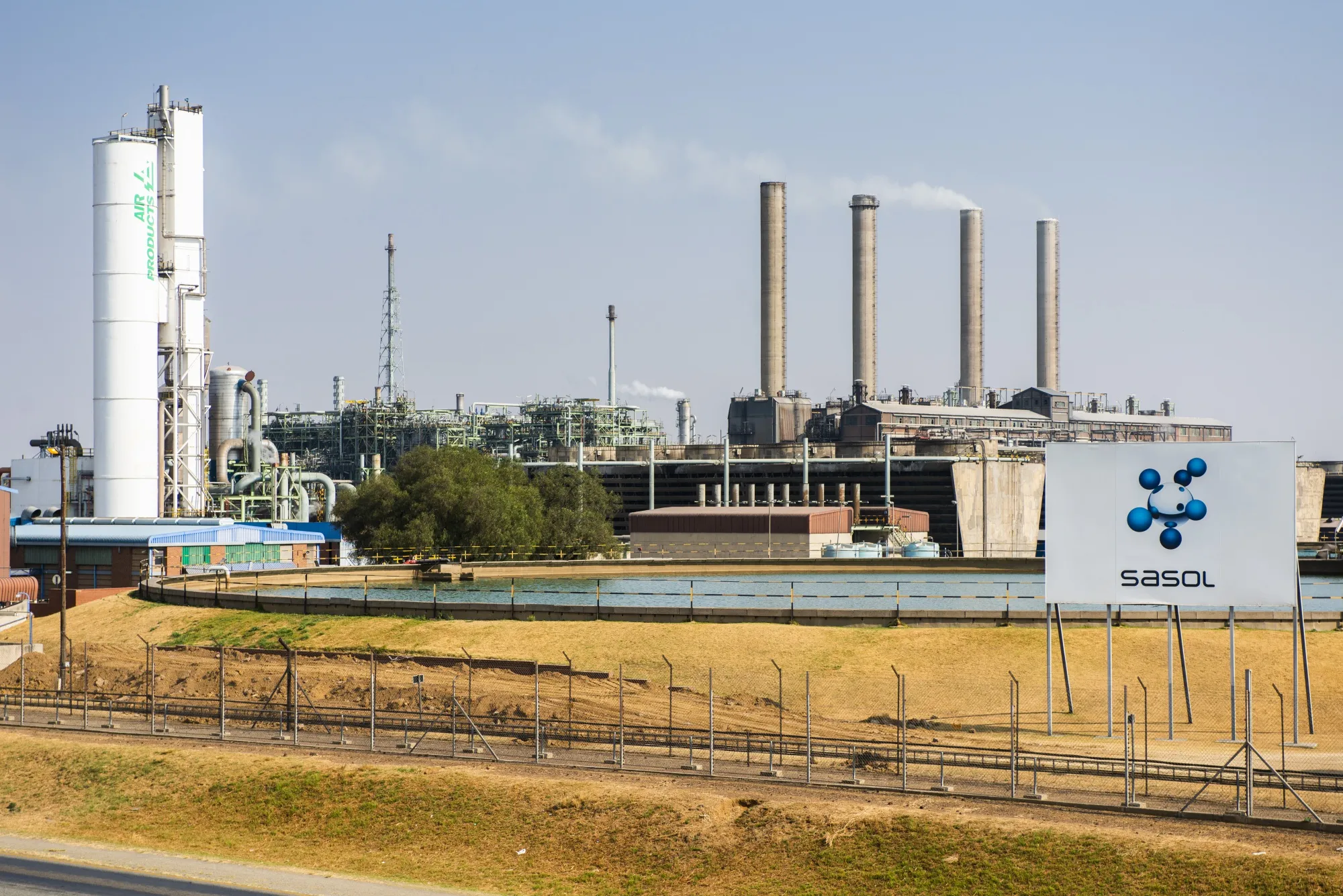 Emissions rise from towers at the Sasol One Site in Sasolburg, South Africa.
