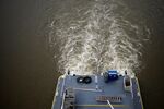 A towboat pushes barges up the Mississippi River.