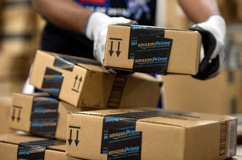 An employee stacks items to be shipped at the Amazon.com Inc. fulfillment center in Phoenix.