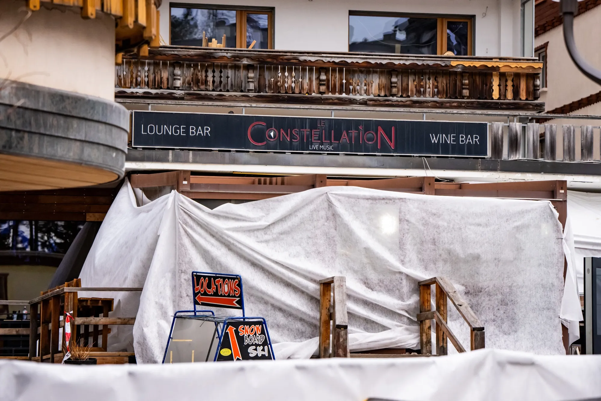A covered entrance to Le Constellation, where a fire broke out during New Year's Eve celebrations, in the Alpine ski resort town of Crans-Montana.