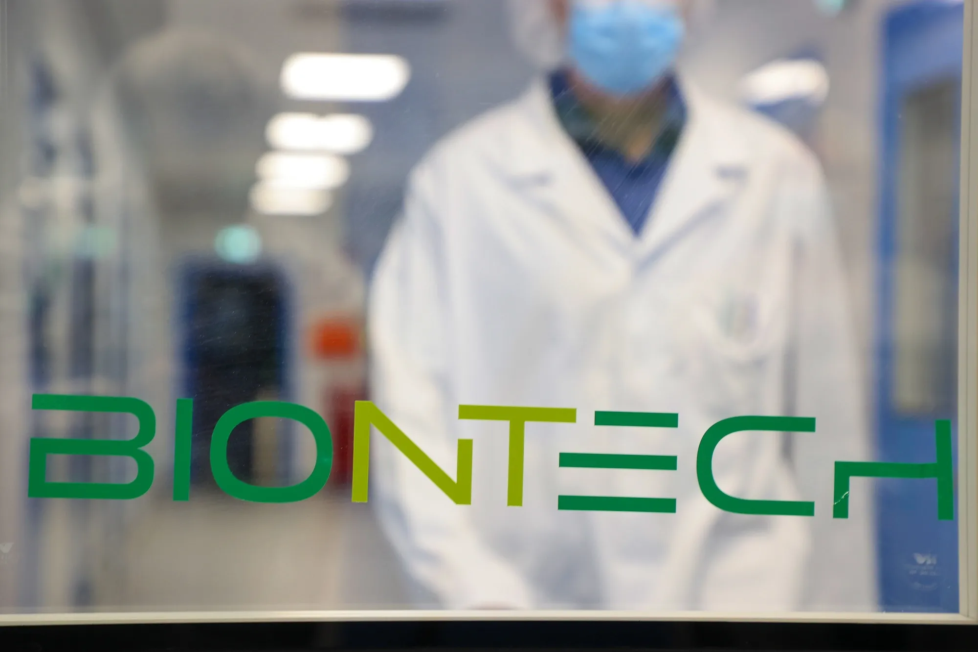 Am employee in a corridor at the BioNTech SE Covid-19 vaccine production laboratory in Marburg, Germany.