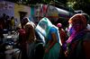 Residents fill water from a Delhi Municipal Corp. truck in New Delhi on April 30, 2022.