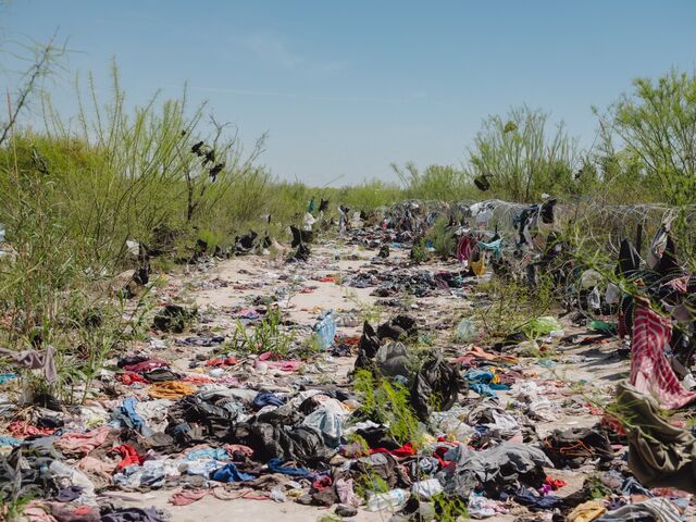 The belongings of migrants on the property of Poncho Nevarez.