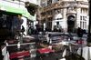 Pedestrians are reflected in the window of a restaurant in Buenos Aires, Argentina, on Tuesday, Aug. 13, 2019. In the wake of President Mauricio Macri's stunning rout in primary elections over the weekend, investors dumped its stocks, bonds and currency en masse, leaving much of Wall Street wondering whether the country was headed for yet another default.