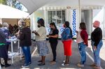 Residents queue for their Covid-19 vaccine at the community health center vaccination site in the Khayelitsha township of Cape Town, South Africa, on Wednesday, Sept. 8, 2021. 