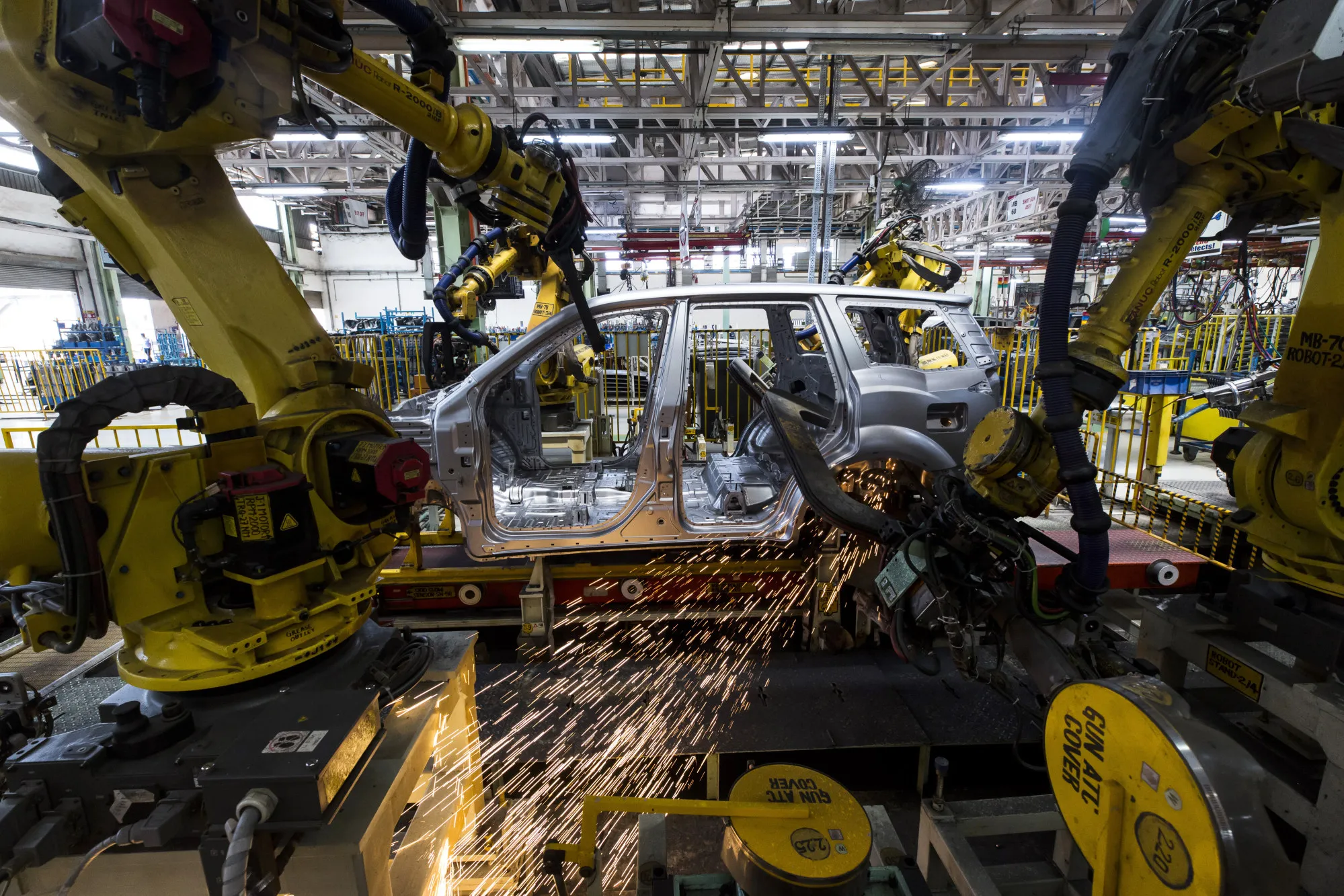 Robotic arms assemble a car on the production line at Mahindra &amp; Mahindra’s facility in Maharashtra.