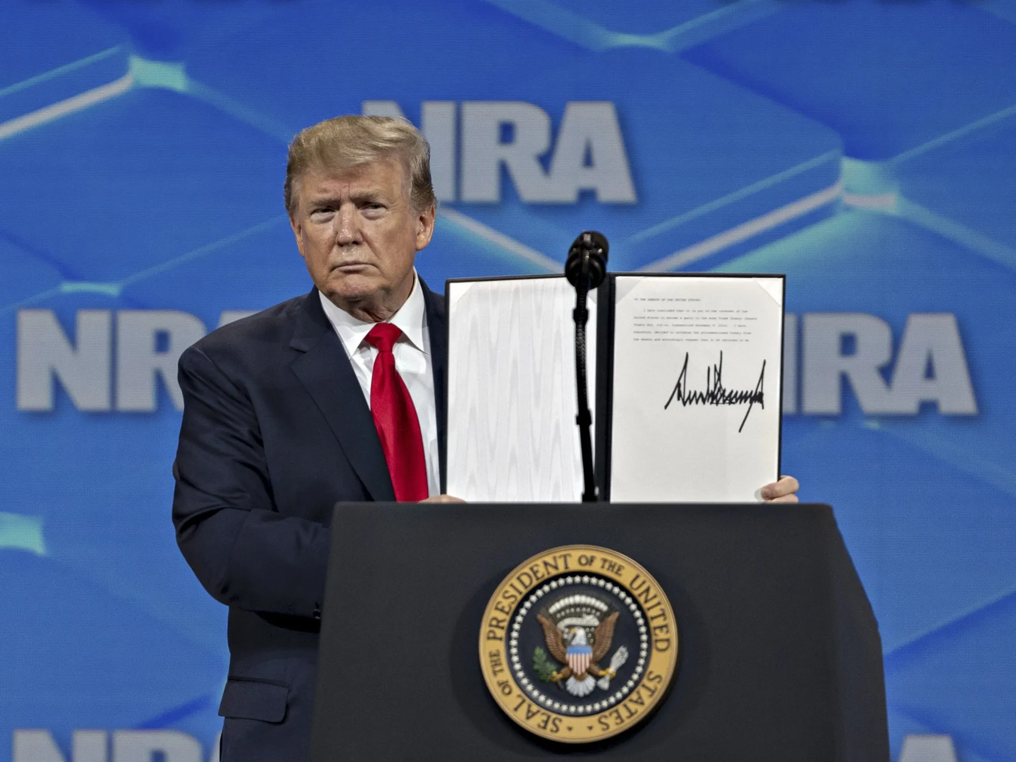U.S President Donald Trump holds a signed letter asking the U.S. Senate to stop the ratification process of the UN Arms Trade Treaty in Indianapolis,&nbsp;U.S., on , April 26, 2019.