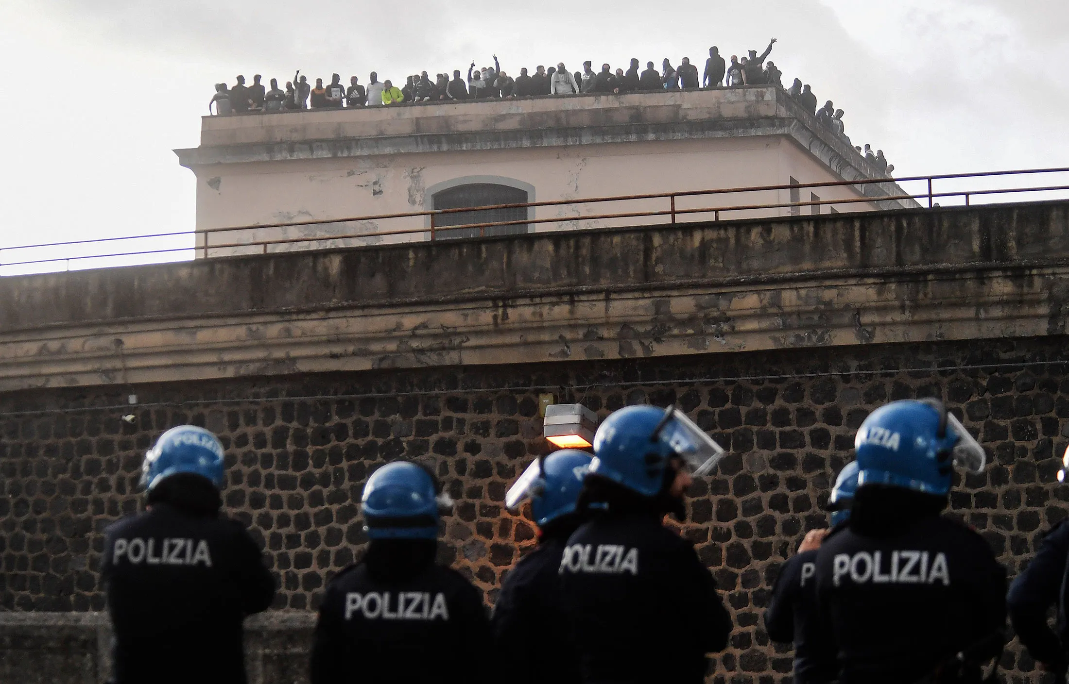 Inmates protest a ban on visitors at Poggioreale prison in Naples, Italy, on March 8.