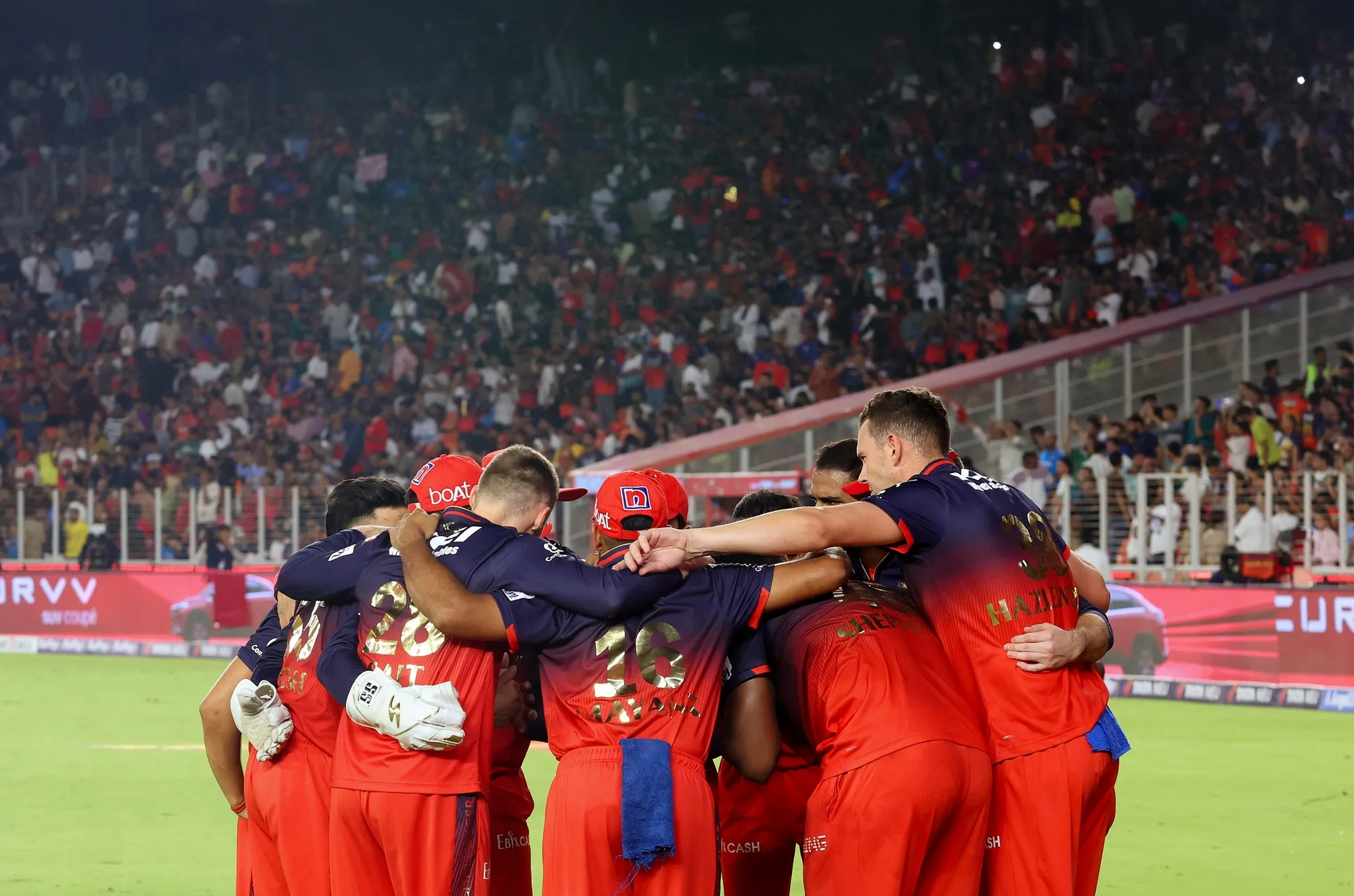 Members of the Royal Challengers Bengaluru huddle during the 2025 IPL Final match in Ahmedabad, India, on June 3.
