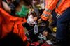 Medics attend to an injured woman in Tsim Sha Tsui on Aug. 11.