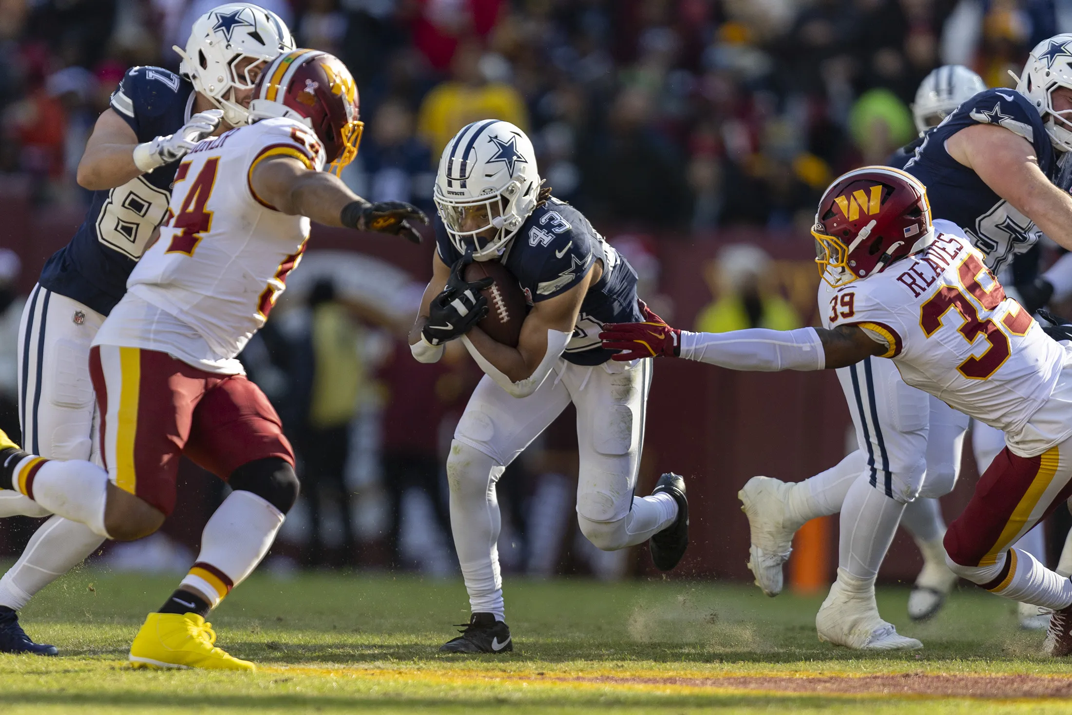 Dallas Cowboys running back Malik Davis tries to hit a running lane during game against the Washington Commanders at Northwest Stadium in Landover, Maryland, on Dec. 25, 2025.