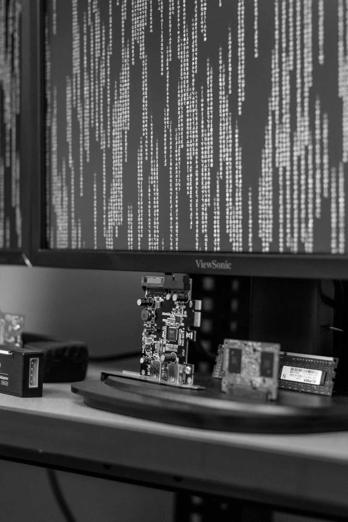 Disassembled hard drives and computer screens in the ICAC Task Force office.