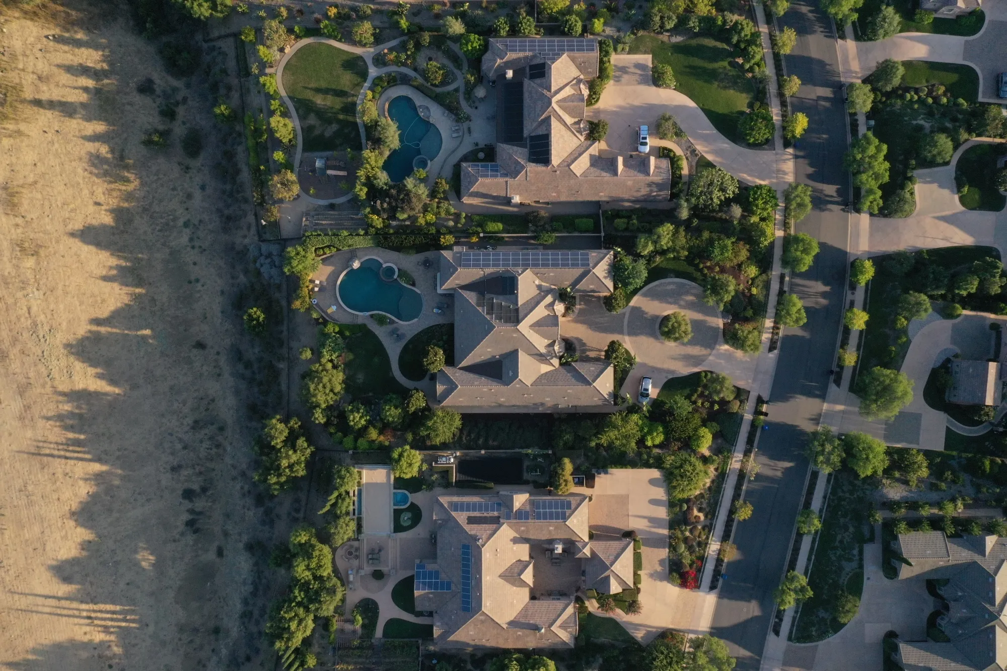 Single-family homes with rooftop solar panels and backyard pools are seen in this aerial photograph taken over a Lennar Corp. development in San Diego, California, U.S., on Tuesday, Sept. 1, 2020. U.S. sales of previously owned homes surged by the most on record in July as lower mortgage rates continued to power a residential real estate market that’s proving a key source of strength for the economic recovery.