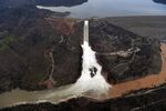 The Oroville Dam spillway releases 100,000 cubic feet of water per second down the main spillway in Oroville, California, on Feb. 13, 2017.
