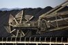 A bucket wheel reclaimer operates on a coal stockpile site at the Onahama port of Iwaki City, Fukushima Prefecture, Japan, on Friday, Feb. 7, 2014. With the loss of nuclear plants, which produced more than 25 percent of Japan's electricity before the disaster, the country have had to rely on oil, coal and gas-fired plants. The cost of importing those fuels has driven the country into a trade deficit for 18 straight months while the current-account shortfall widened to a record in November.