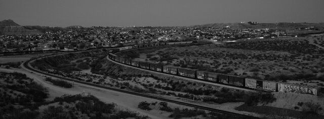 A cargo train travels at night through El Paso, Texas. 