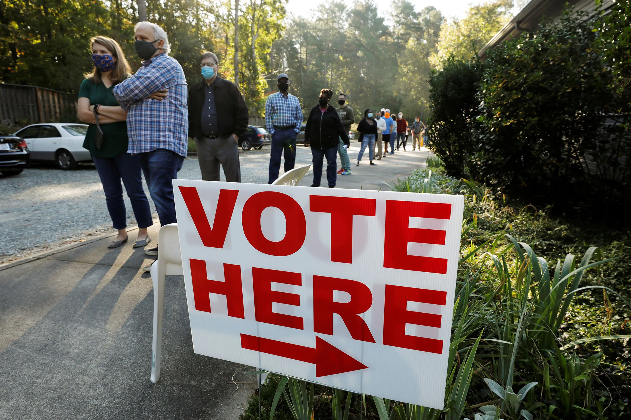 Voters in Durham, N.C., wait in line on the first day of the state’s in-person early voting&nbsp;on Oct. 15.