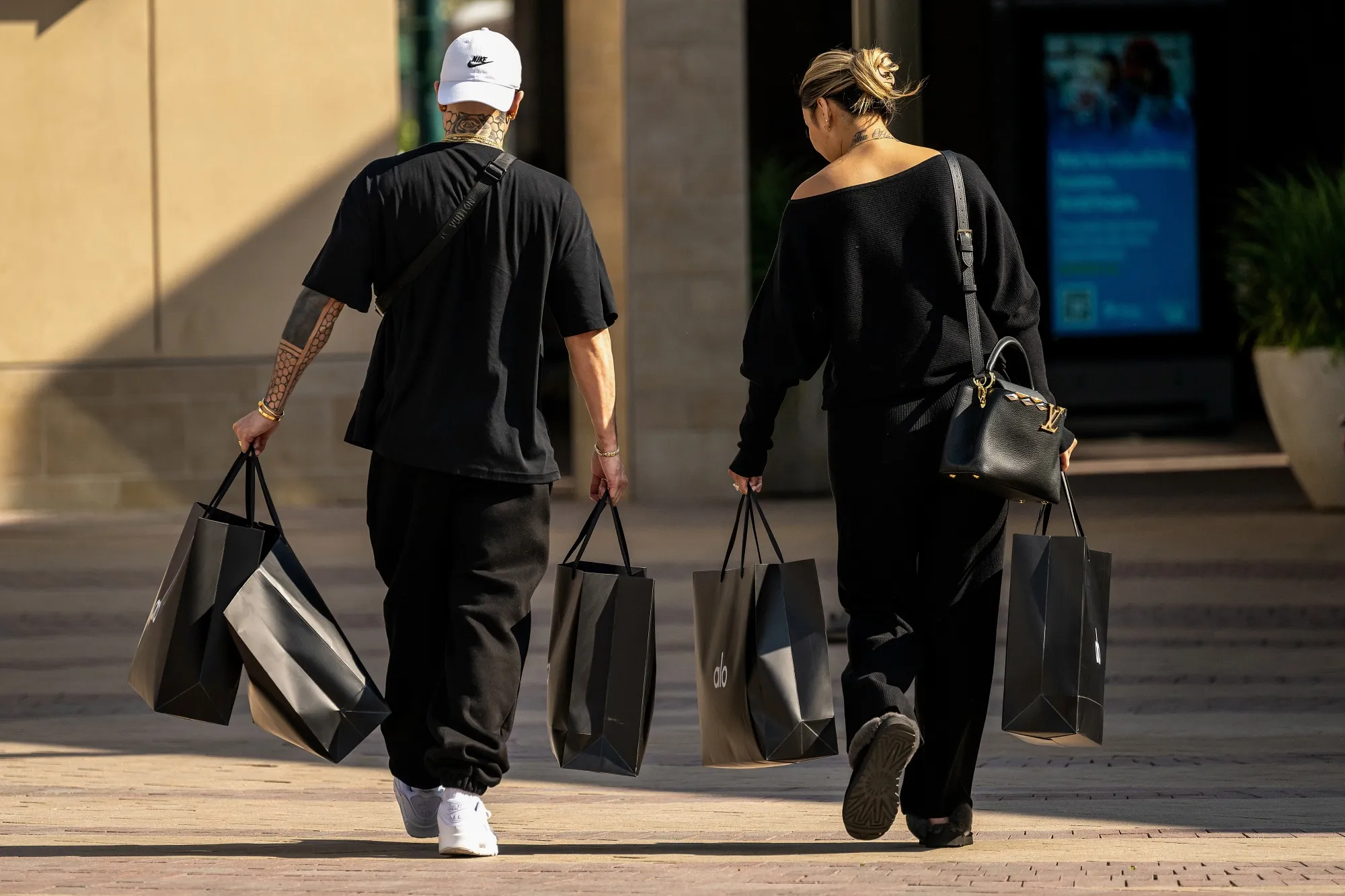 Shoppers carry bags in Walnut Creek, California.