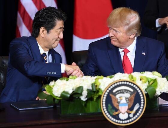 Trump, Abe Ink Trade Deal as U.S. Withholds Auto Tariffs For Now