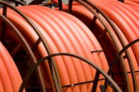 Reels of orange communication cable.