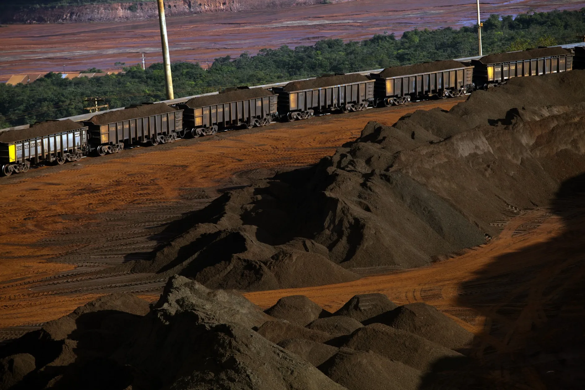 Crushed iron ore is transported in railroad cars at Vale's Brucutu mine in Barao de Cocais, Brazil.