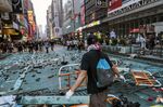 A demonstrator makes a barricade in Hong Kong on Oct. 20.