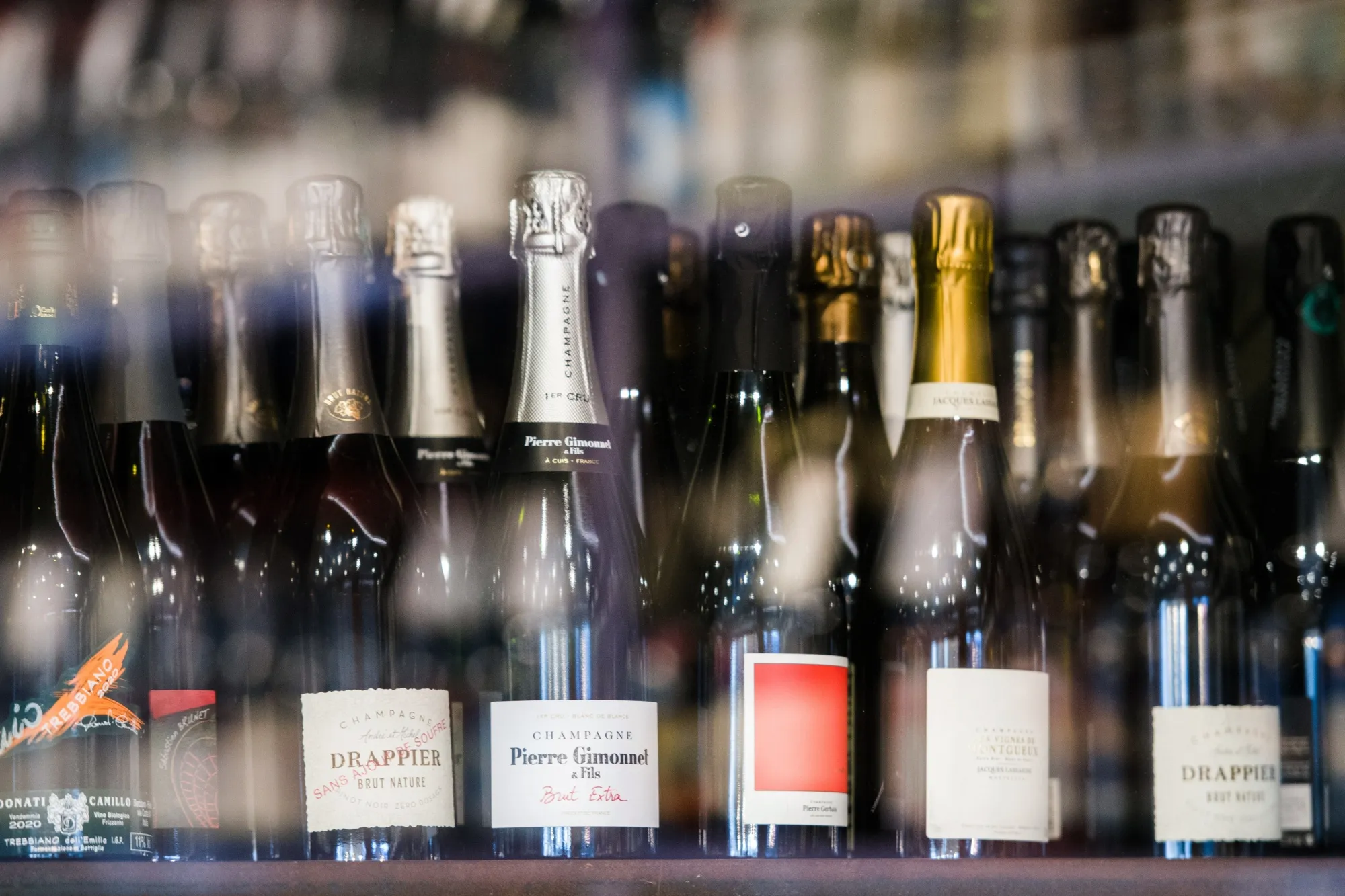 Bottles of champagne for sale in a wine store in Paris, France.