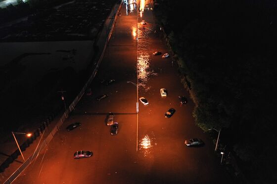 Urban Rowboat Rescues and Chest-Deep Water: Scenes of the Flood