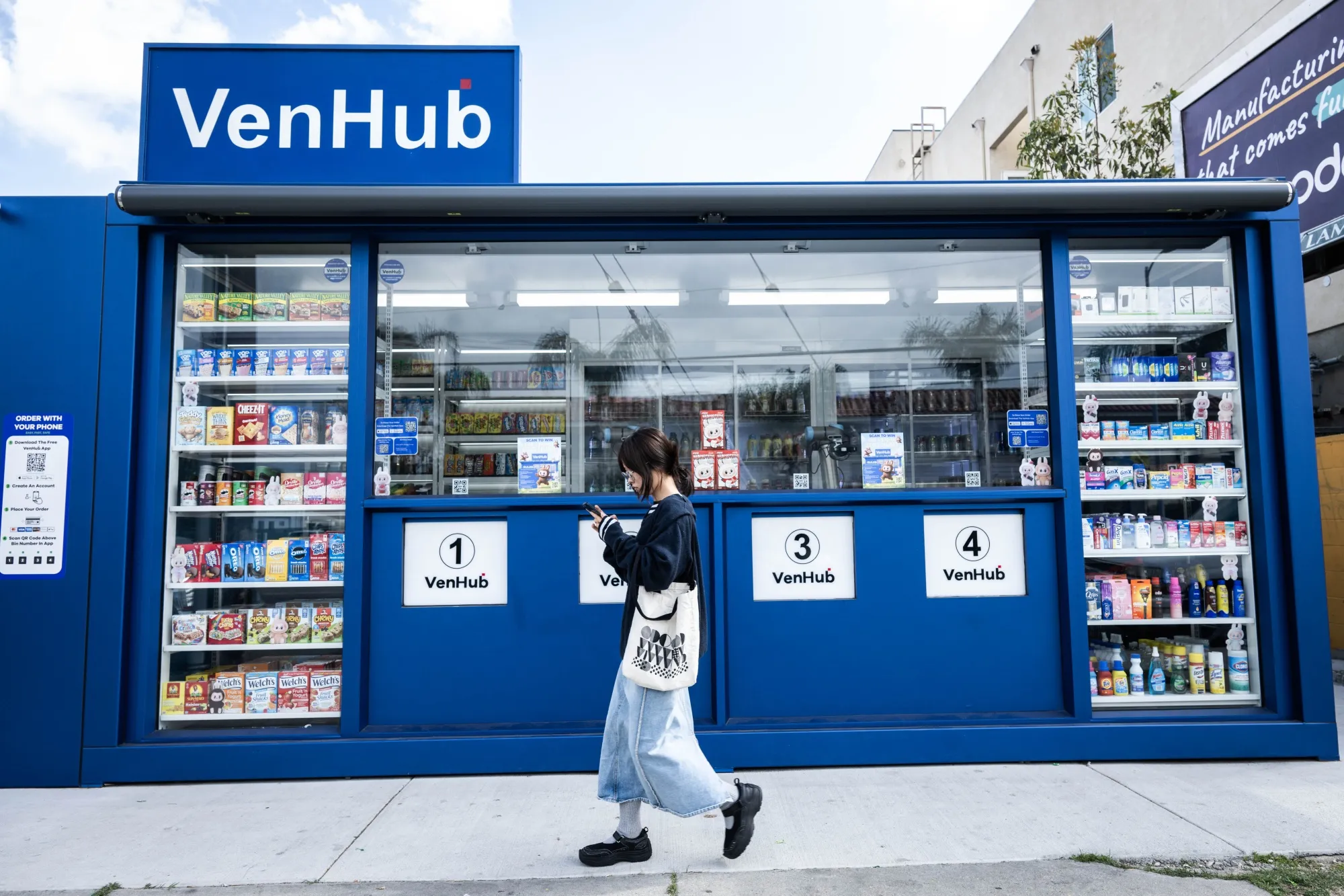 A woman passes VenHub store&nbsp;in Hollywood.
