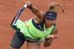 Japan's Naomi Osaka serves against Amanda Anisimova of the U.S. during their first round match at the French Open tennis tournament in Roland Garros stadium in Paris, France, Monday, May 23, 2022. Naomi Osaka's 2022 French Open is done following a first-round loss. The players remaining in the tournament see and hear products of her frank discussion about anxiety and depression a year ago -- from new &quot;quiet rooms&quot; and on-call psychiatrists at Roland Garros to a broader sense that mental health is a far-less-taboo topic than it once was. (AP Photo/Christophe Ena, File)
