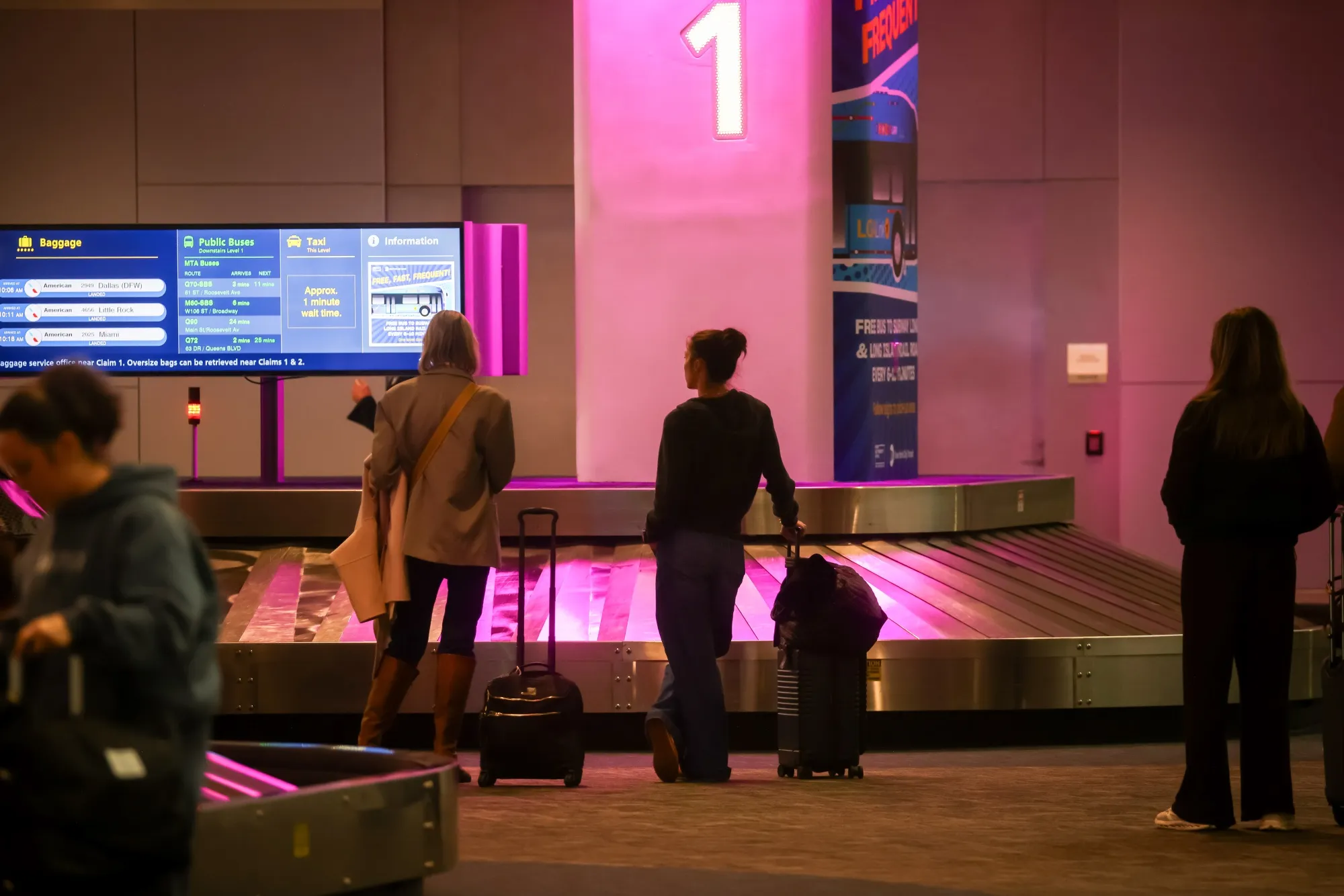 Travelers near a baggage claim carousel at&nbsp;LaGuardia Airport (LGA) in New York on&nbsp;Nov. 7.