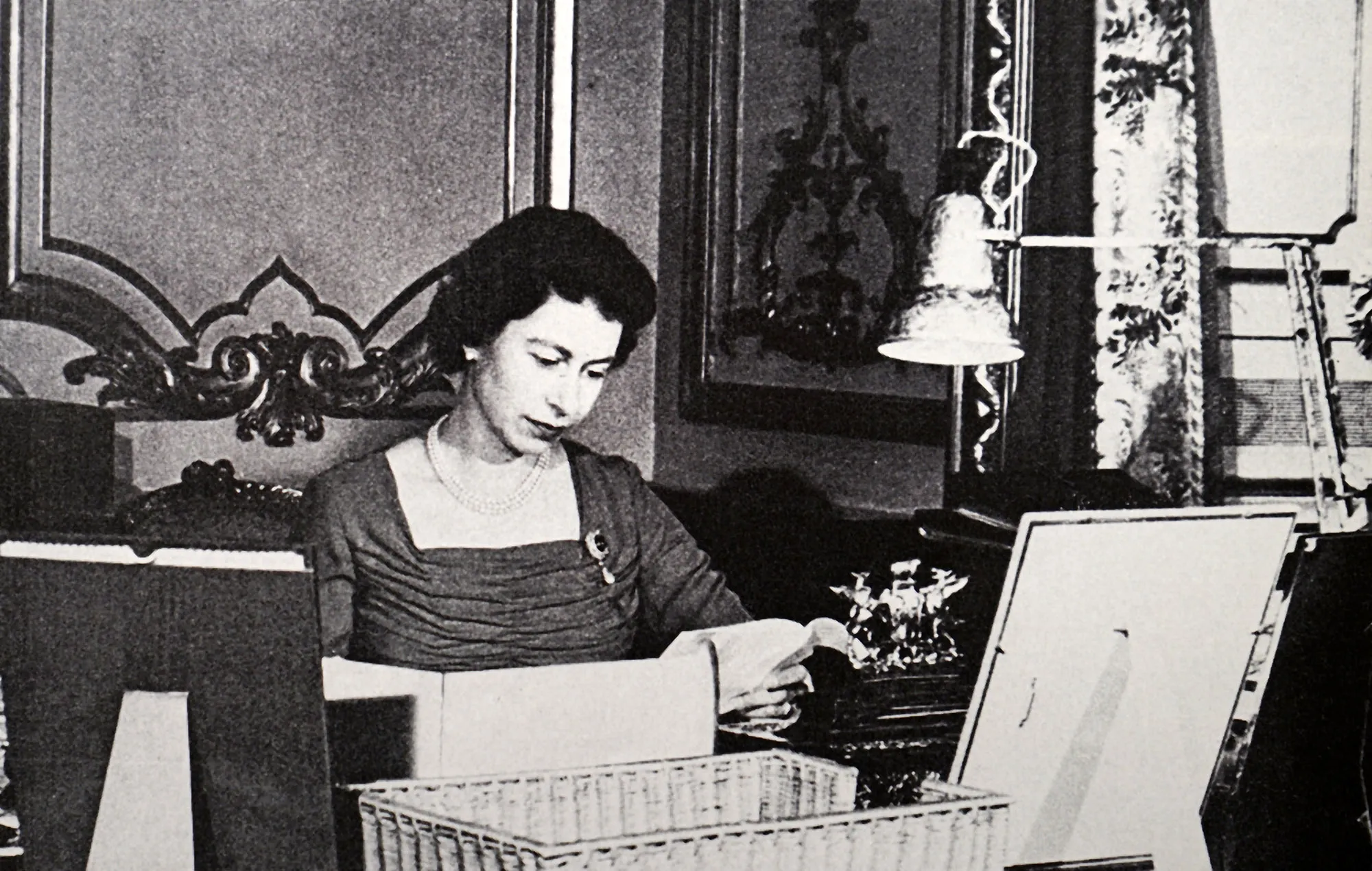 Queen Elizabeth II reading despatch papers from her Red Box, circa 1956.&nbsp;