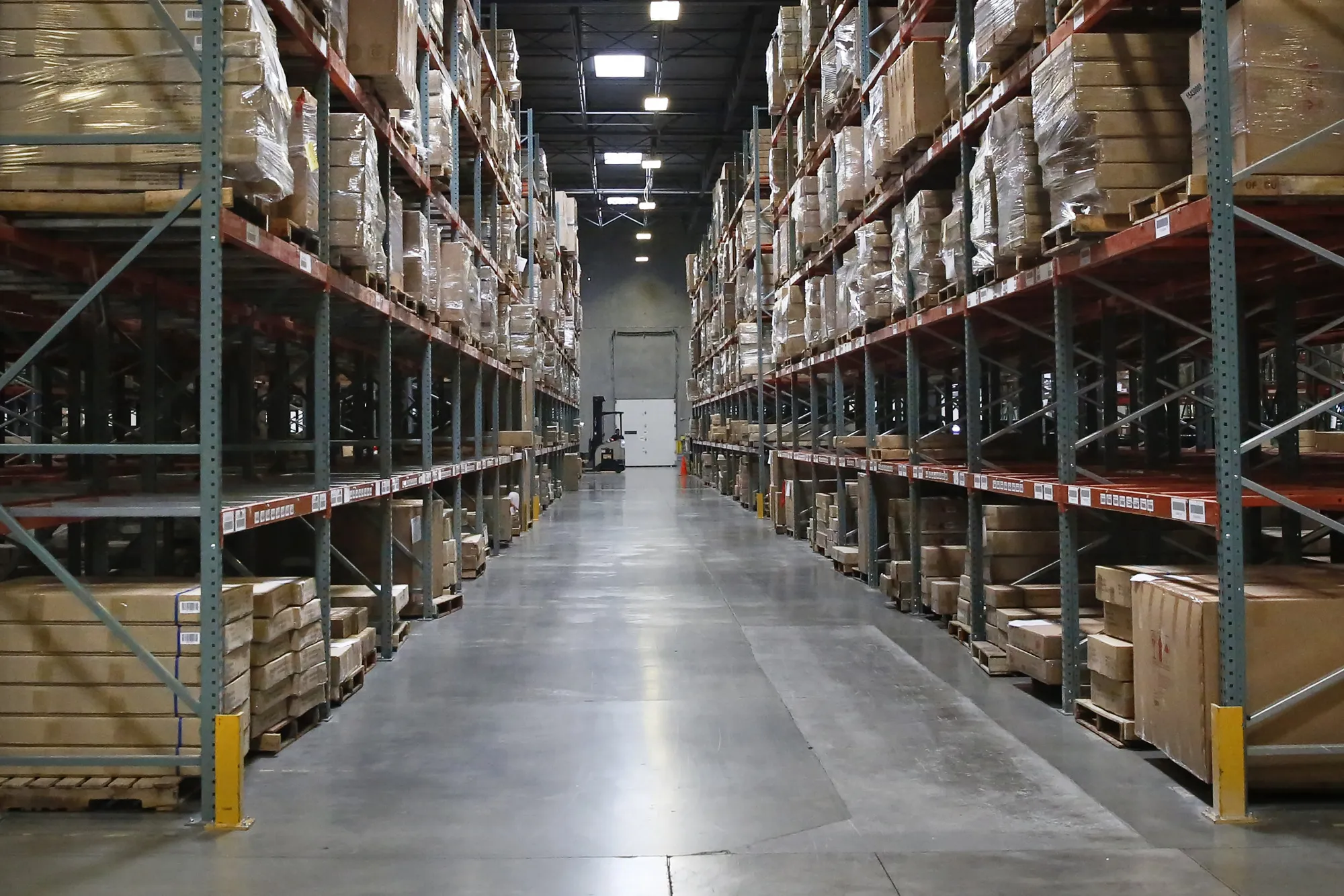 Packages sit stacked on shelves at the Overstock.com Inc. fulfillment center in Salt Lake City, Utah.