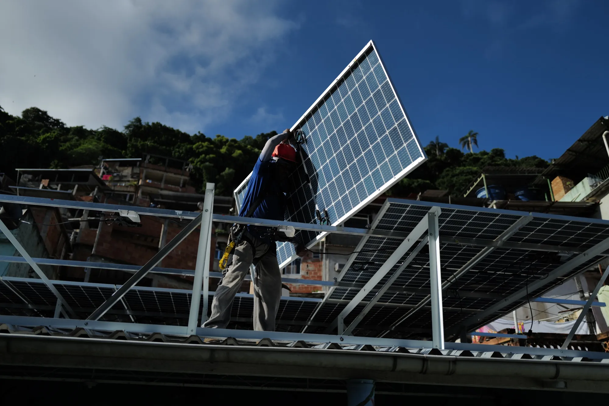 A solar panel installation in progress&nbsp;on a nursery in the Chapeu Mangueira favela in Rio de Janeiro, Brazil in March 2023.