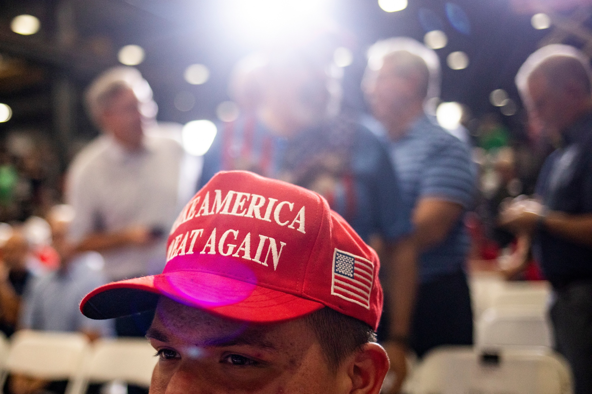 An attendee wears a "MAGA" hat during a campaign event with former US President Donald Trump, not pictured, at Alro Steel in Potterville, Michigan, US, on Thursday, Aug. 29, 2024. Trump appears to be taking an even deeper dive into the digital-asset world, saying that he'll unveil plans to ensure that the US will be the "crypto capital of the planet." Photographer: Emily Elconin/Bloomberg