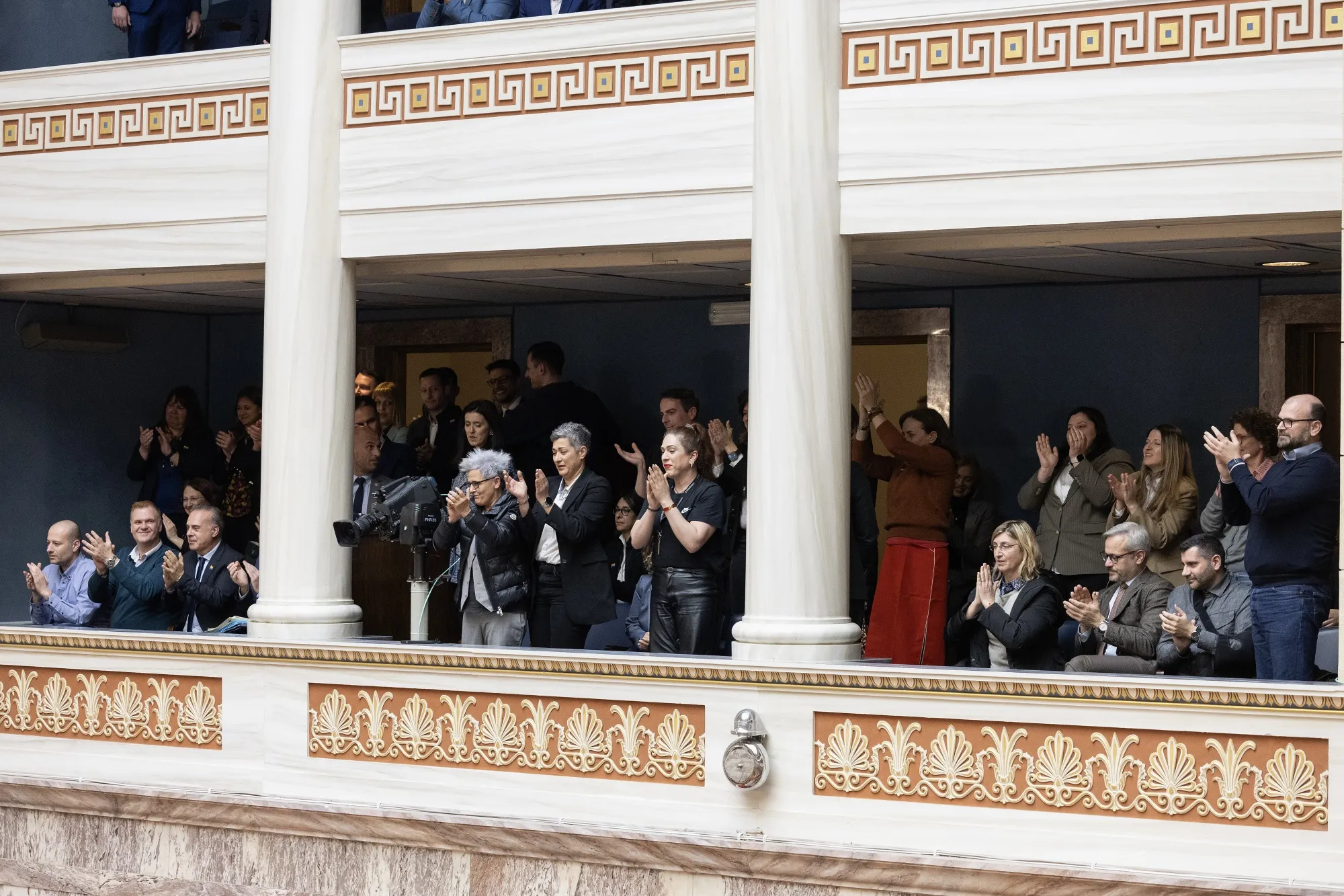 Visitors applaud after a vote on the same-sex marriage bill in parliament in Athens on Feb. 15.