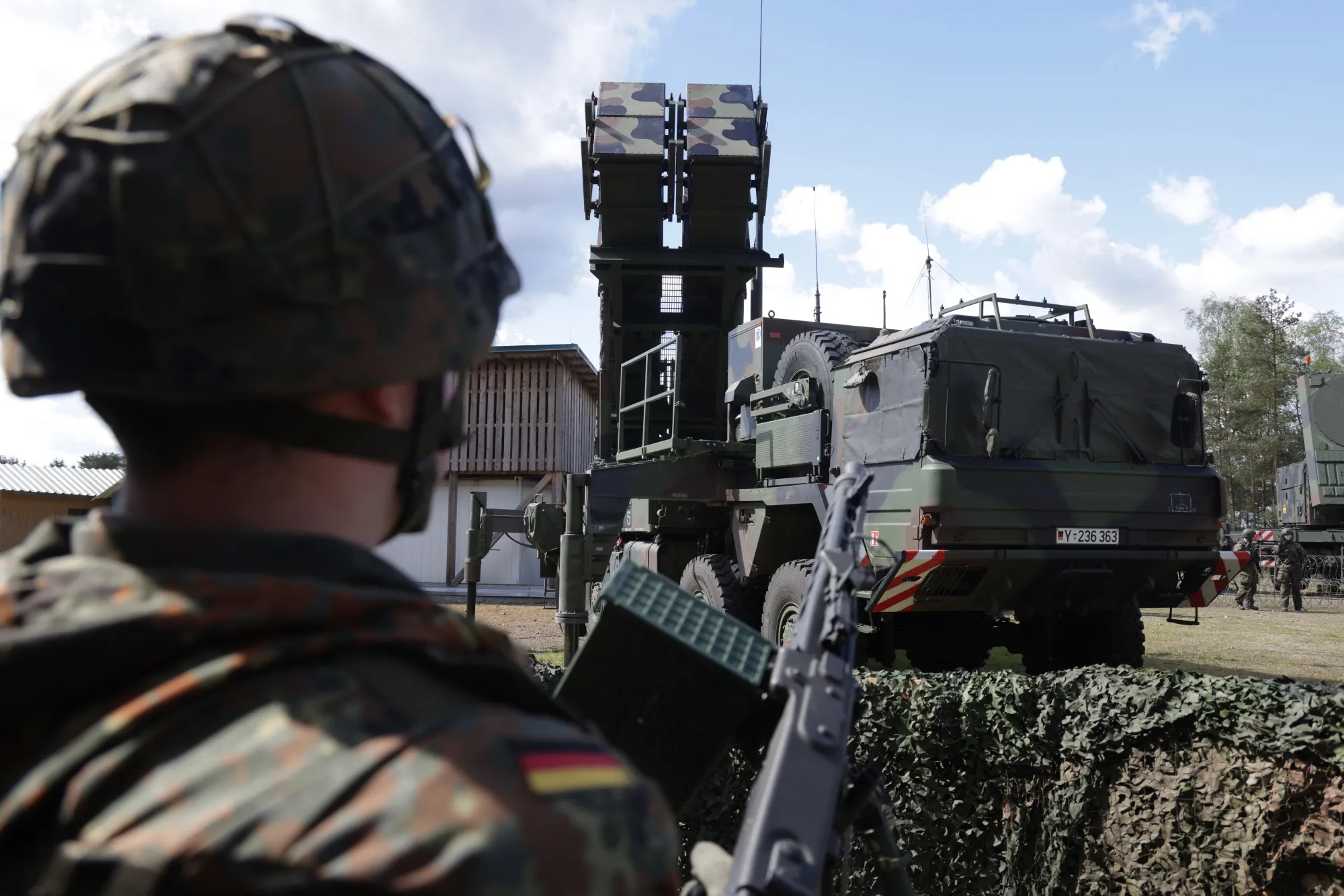 A reservist member of&nbsp;the German armed forces&nbsp;stands next to a launcher of a Patriot missile system.