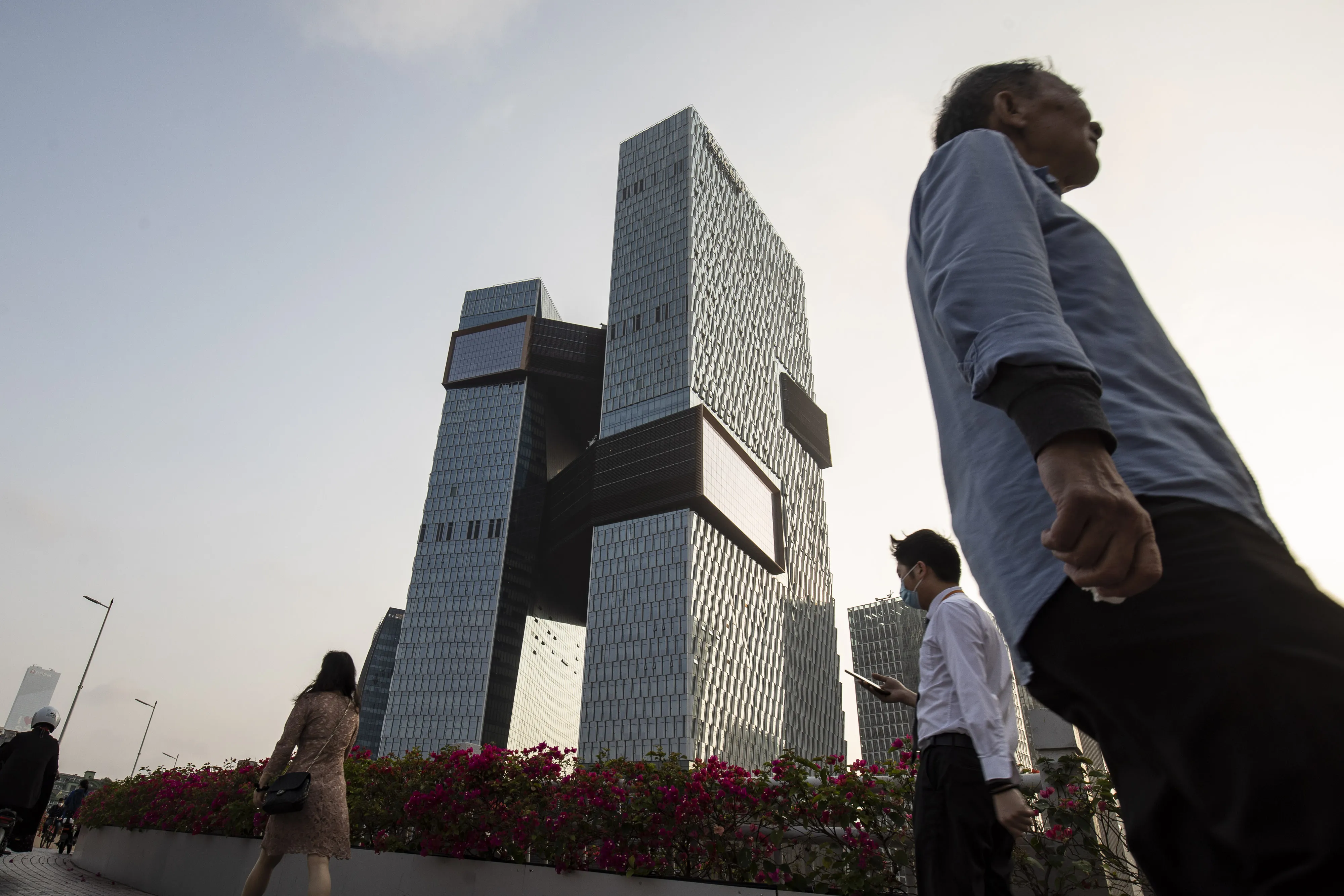 Pedestrians&nbsp;near the Tencent Holdings Ltd. headquarters in Shenzhen, China.