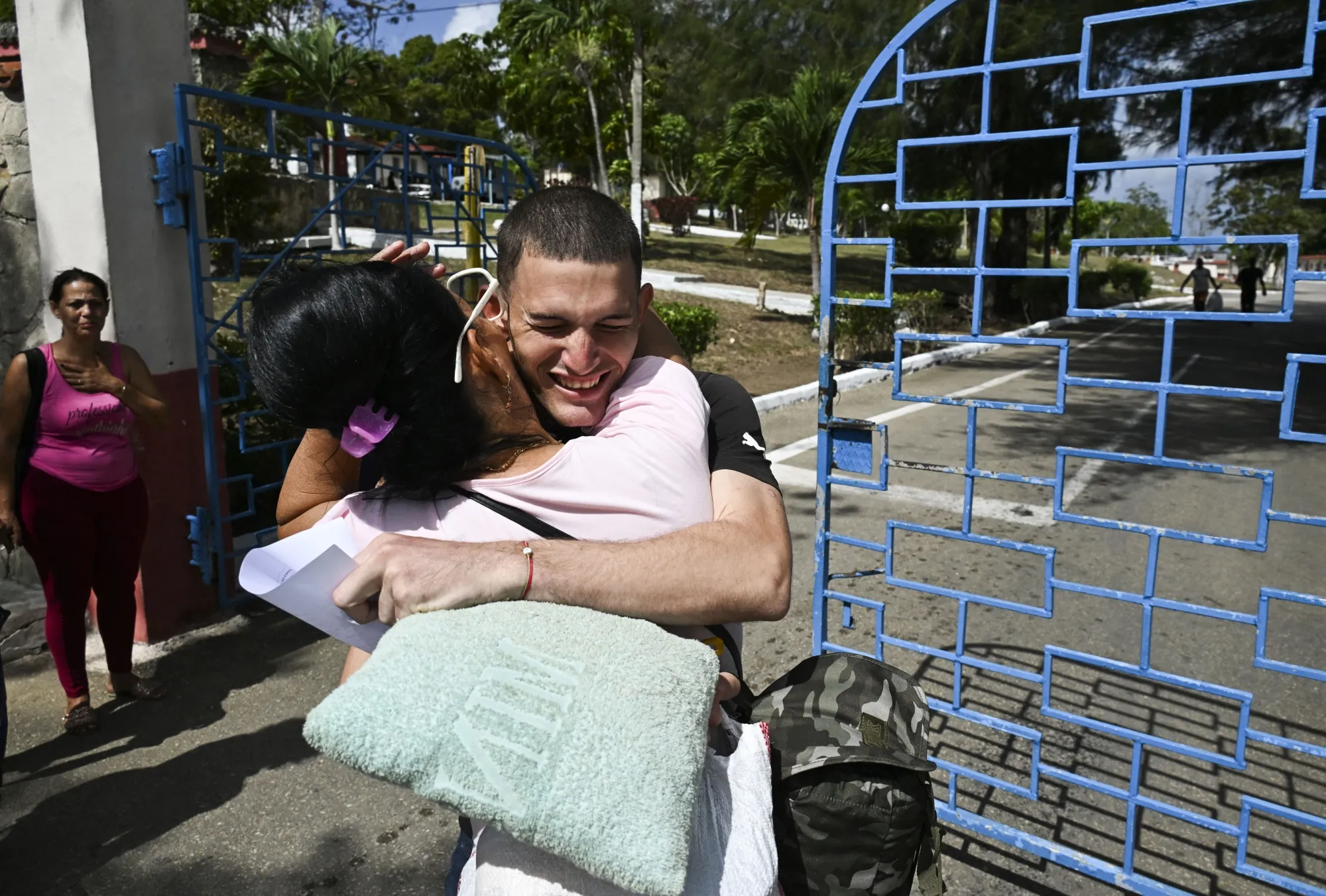 An inmate embraces a relative after release from La Lima prison in Havana on April 3.