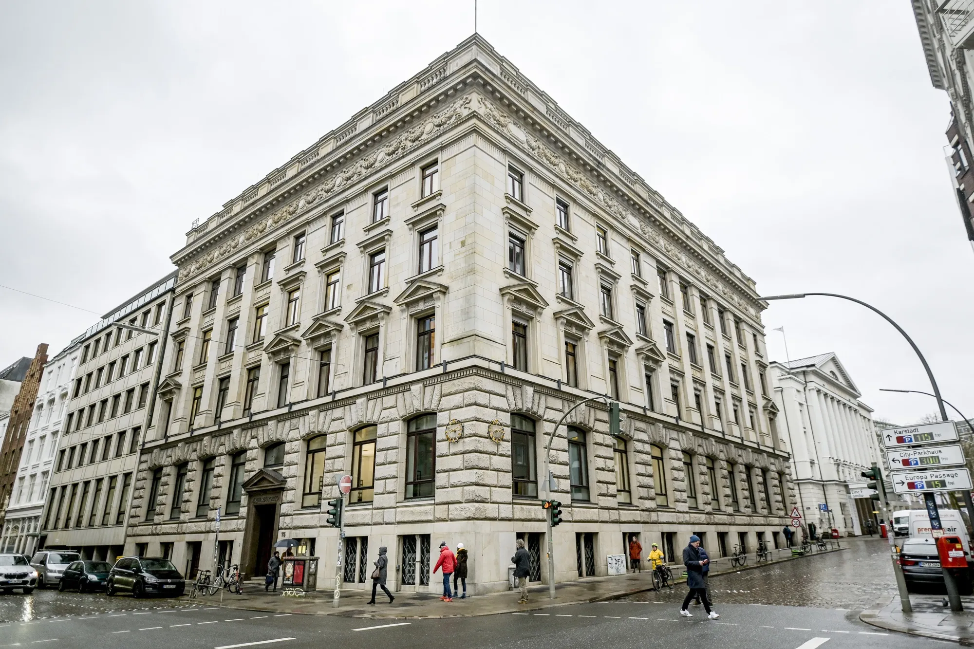 Cars drive past the M.M. Warburg & Co. building in Hamburg.